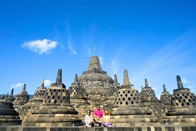 Borobudur & Prambanan Private Tour with Climb-Up Access Included - Borobudur climb-up: summit photos of Buddhas and volcano views